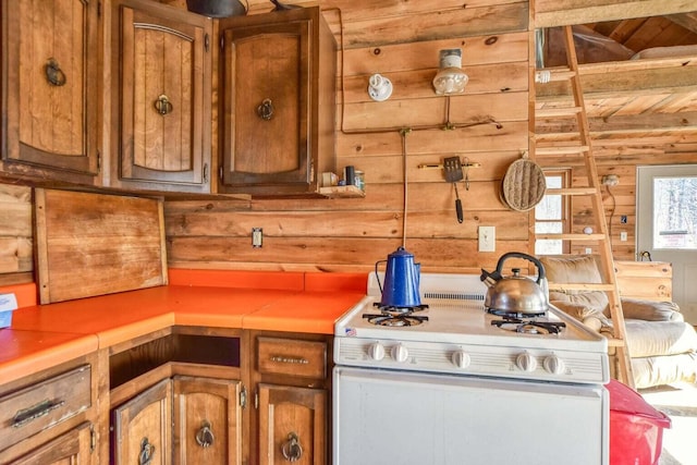 0 Little Huston Brook Rd, Concord Twp, ME 04920 - kitchen with gas range gas stove, brown cabinetry, light countertops, and wooden ceiling