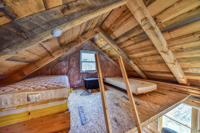 bedroom featuring vaulted ceiling with beams and wood ceiling