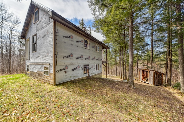 view of side of home with a storage unit