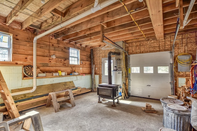 garage featuring a wood stove and gas water heater