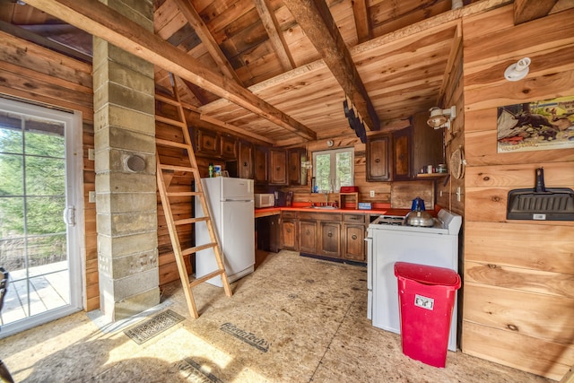 kitchen featuring sink, lofted ceiling with beams, white appliances, wooden walls, and wood ceiling