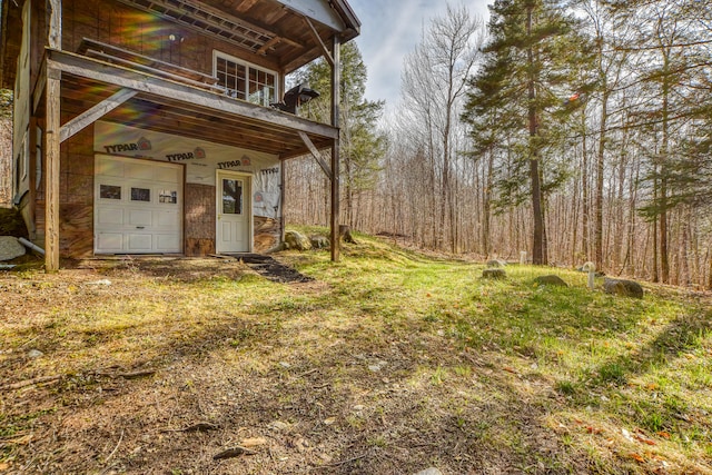 view of yard featuring a garage