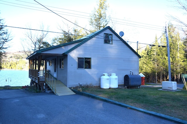 view of side of property with a yard