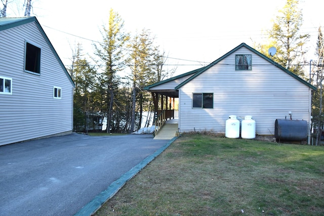 view of side of home featuring a yard