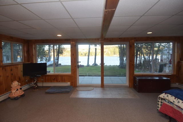 interior space featuring a baseboard radiator and a drop ceiling