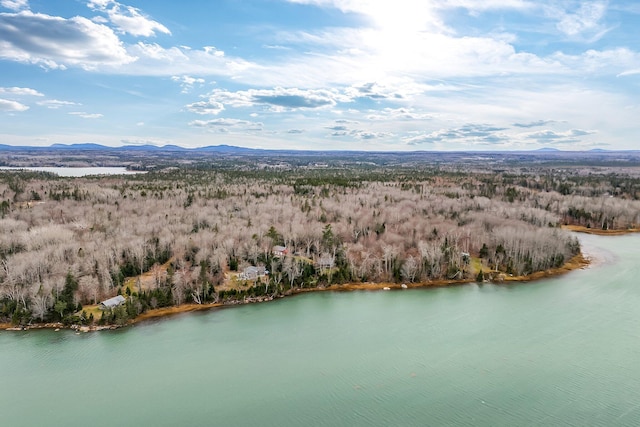 aerial view featuring a water and mountain view