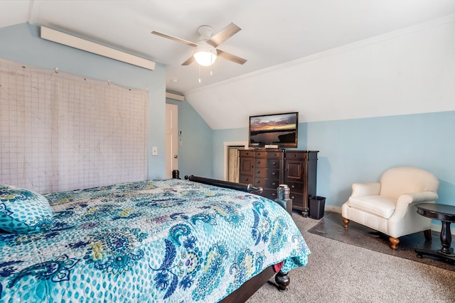 carpeted bedroom featuring ceiling fan, lofted ceiling, and ornamental molding