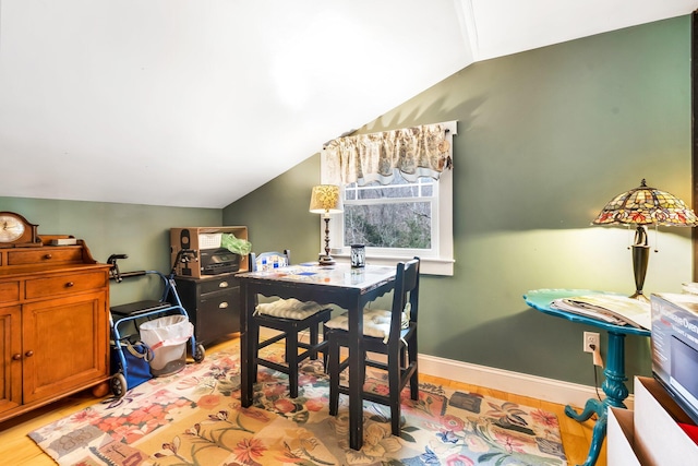 office featuring light hardwood / wood-style floors and lofted ceiling