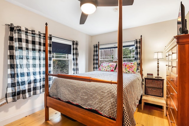 bedroom with ceiling fan and hardwood / wood-style floors