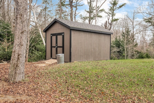 view of outdoor structure with a lawn