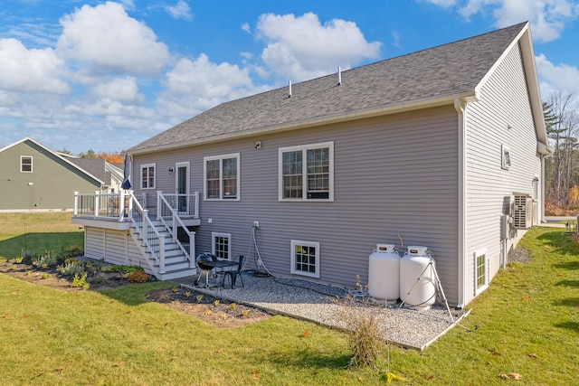 11 Beacon Dr, Brunswick, ME 04011 - rear view of house featuring a lawn, a wooden deck, and a patio