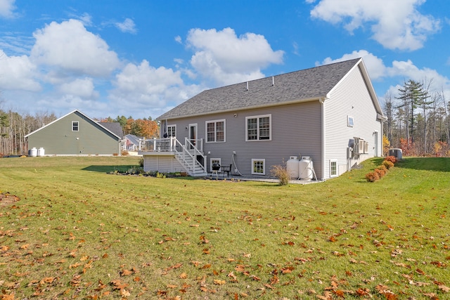 11 Beacon Dr, Brunswick, ME 04011 - back of property with cooling unit, a deck, and a yard