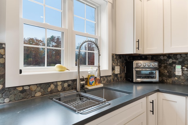 11 Beacon Dr, Brunswick, ME 04011 - kitchen with plenty of natural light and white cabinetry