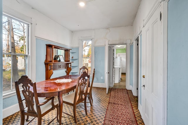 236 High St, Farmington, ME 04938 - dining area with healthy amount of natural light, baseboards, and tile patterned floors