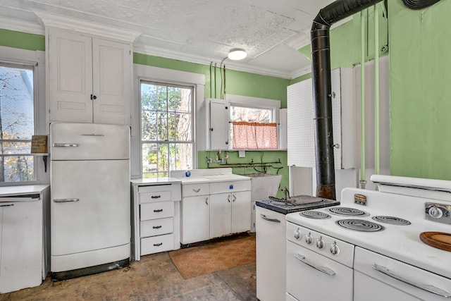 kitchen with white cabinetry, sink, white appliances, and ornamental molding