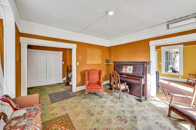 sitting room featuring light colored carpet