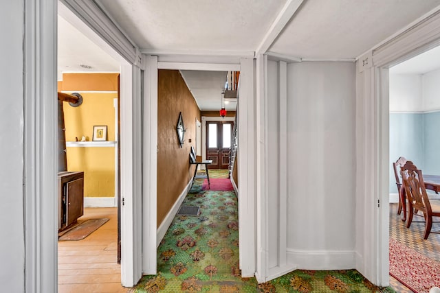 corridor featuring hardwood / wood-style floors