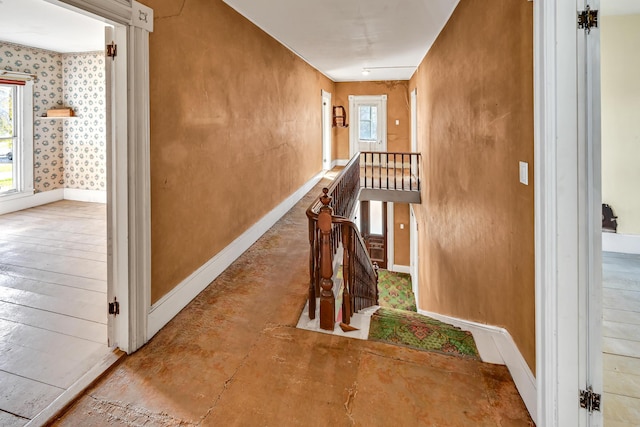 236 High St, Farmington, ME 04938 - hallway featuring baseboards, an upstairs landing, and concrete floors