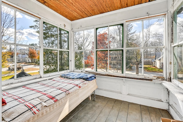 sunroom featuring wood ceiling