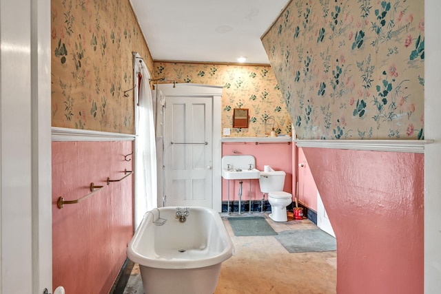 bathroom with a bathing tub and toilet