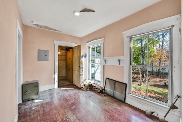 236 High St, Farmington, ME 04938 - spare room with hardwood / wood-style floors, plenty of natural light, electric panel, and baseboards
