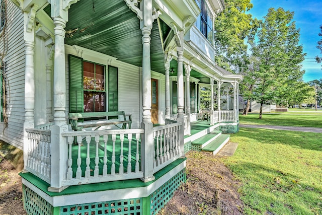 view of property exterior featuring a lawn and a porch