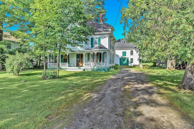 236 High St, Farmington, ME 04938 - victorian house featuring covered porch, a front lawn, and a chimney