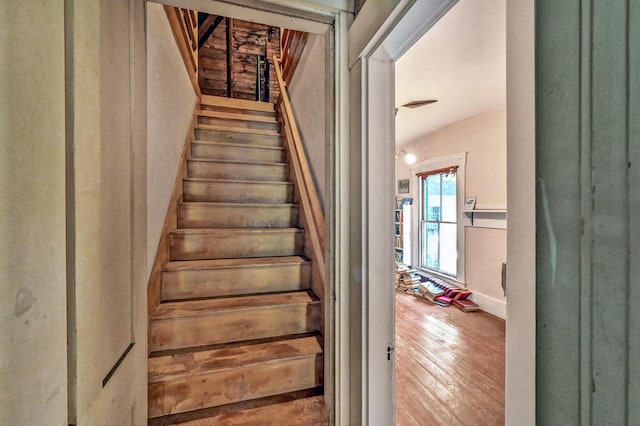 236 High St, Farmington, ME 04938 - stairs featuring wood-type flooring and baseboards