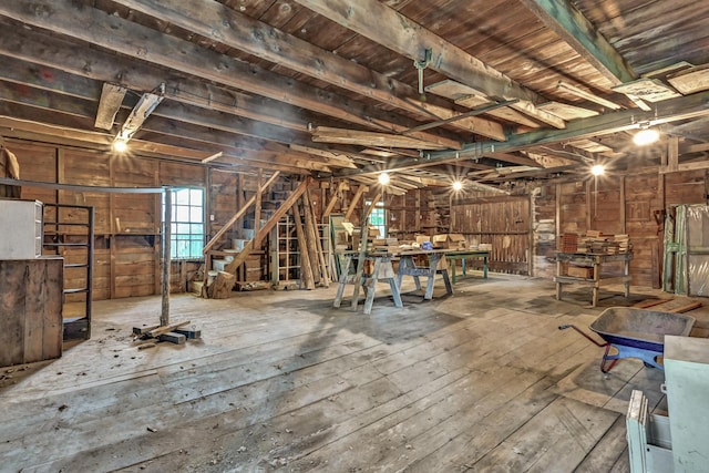 236 High St, Farmington, ME 04938 - misc room with hardwood / wood-style flooring and wood walls