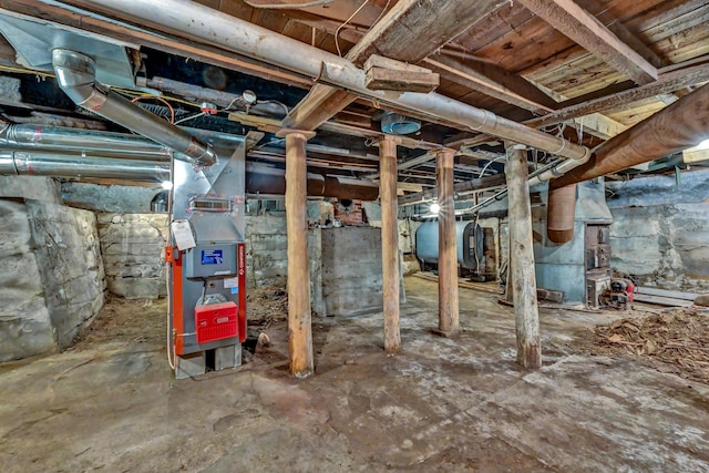 236 High St, Farmington, ME 04938 - unfinished basement featuring oil tank and heating unit