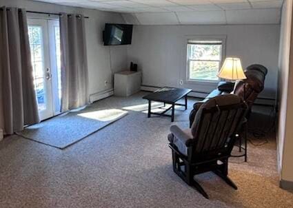 living room featuring carpet floors and a baseboard radiator