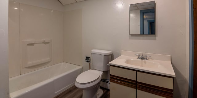 full bathroom with shower / bathing tub combination, wood-type flooring, vanity, and toilet