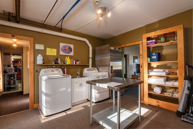 laundry room featuring separate washer and dryer, carpet floors, and cabinets