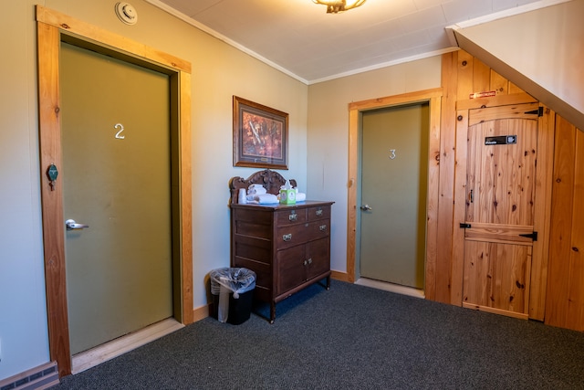 hall featuring carpet and ornamental molding