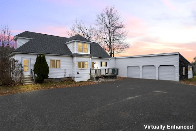 view of front of house with a deck and a garage