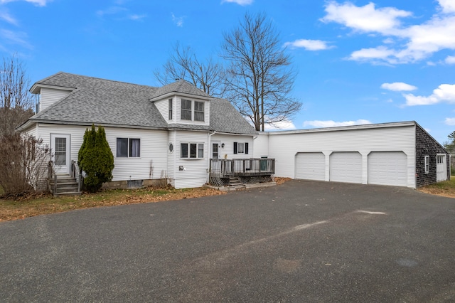 view of front of house featuring a wooden deck and a garage