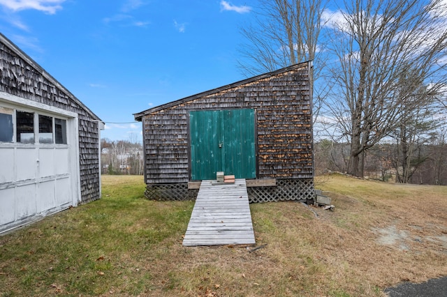 view of outbuilding with a lawn