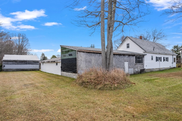 view of property exterior with a yard