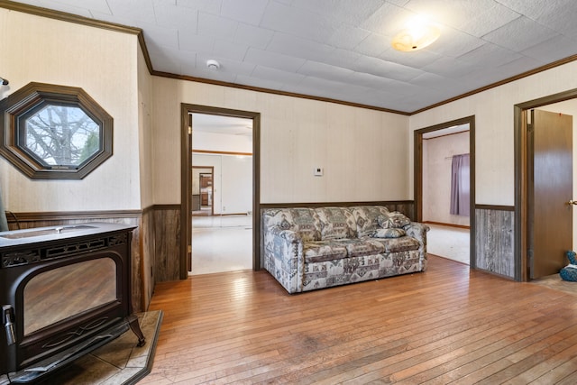 living room featuring hardwood / wood-style floors and ornamental molding