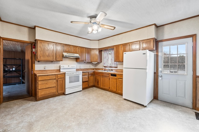 kitchen with light carpet, ornamental molding, a textured ceiling, white appliances, and ceiling fan