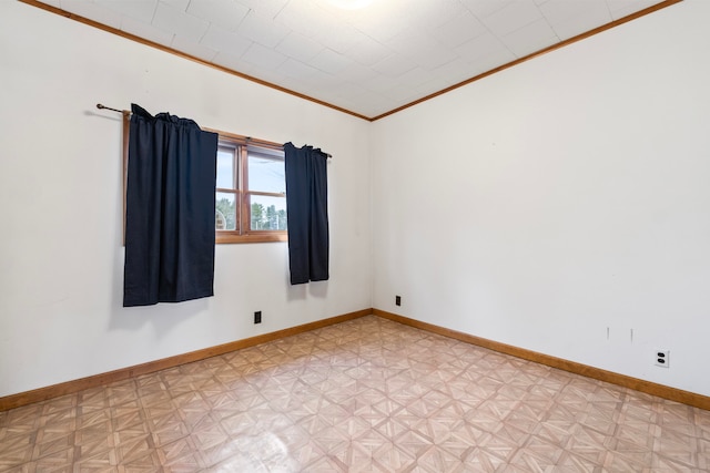 empty room featuring parquet flooring, vaulted ceiling, and crown molding