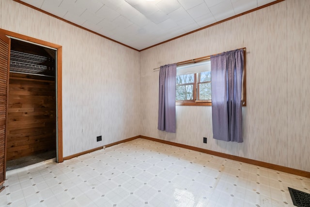 unfurnished room featuring ornamental molding