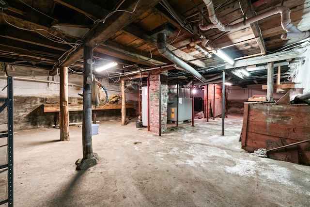 basement with heating unit and water heater