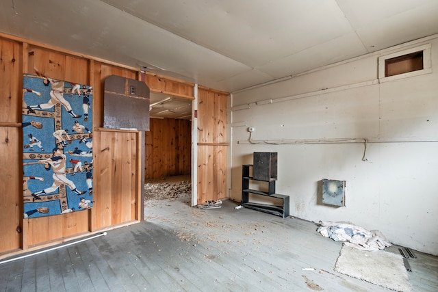 interior space featuring wood walls and wood-type flooring