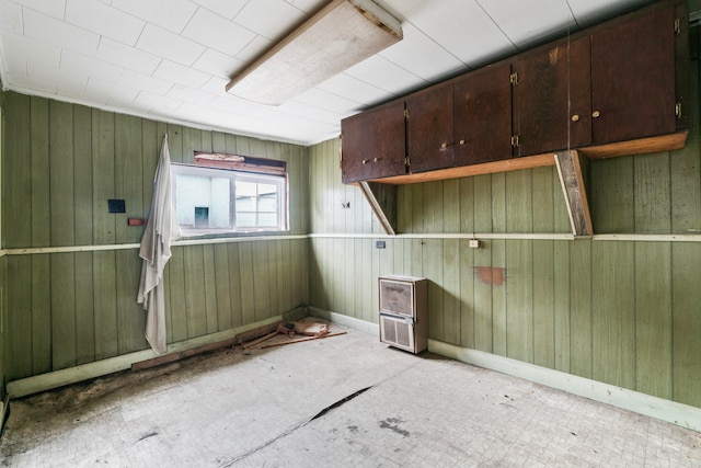 empty room featuring wooden walls