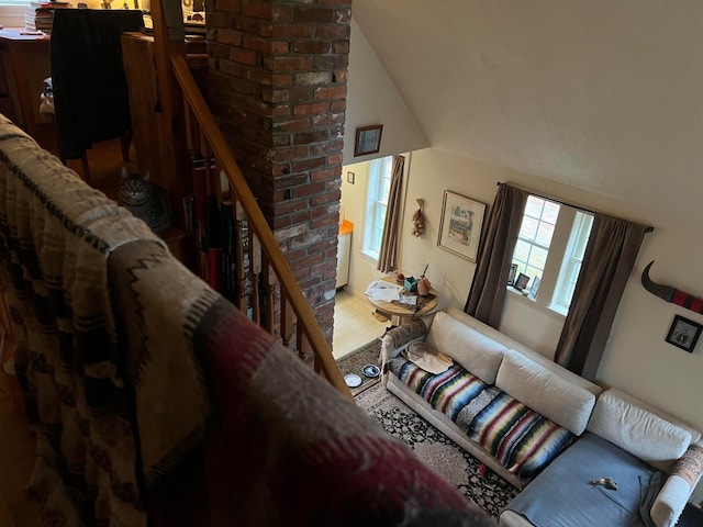 living room featuring high vaulted ceiling