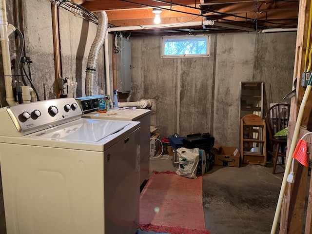 clothes washing area featuring washer and dryer and electric panel