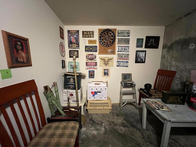 living area featuring concrete flooring