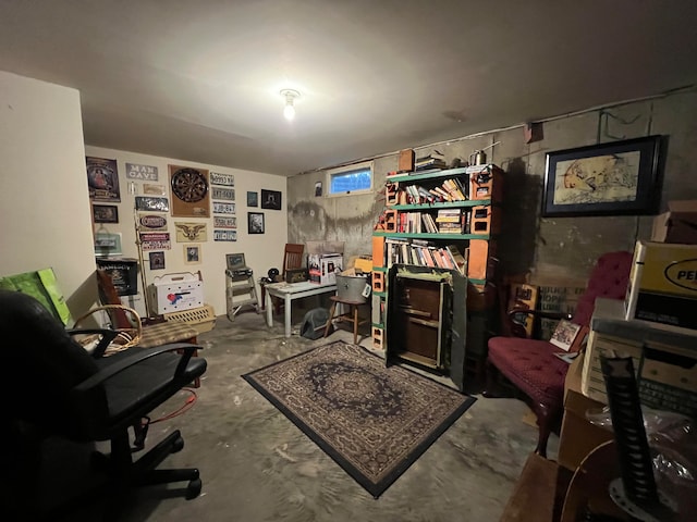 home office featuring concrete flooring