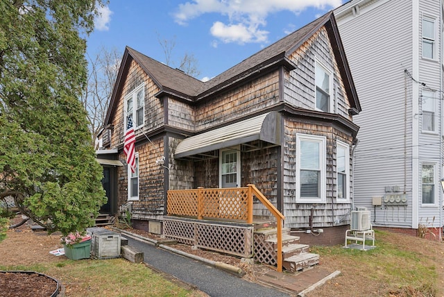 view of front of home featuring cooling unit